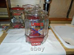 1930's Vintage 12 Lance Jar With Red Metal Stand And Over The Lip Glass LID