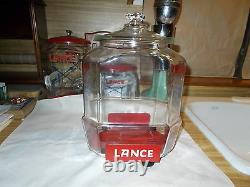 1930's Vintage 12 Lance Jar With Red Metal Stand And Over The Lip Glass LID