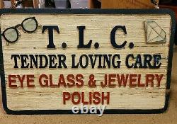 Advertising sign for TLC Eye glass and Jewelry polish, wooden