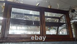 Antique Slanted Glass General Store Display Cabinet with Adjustable Shelf Brackets